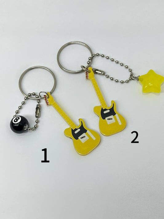 Yellow electric guitar keychains.
