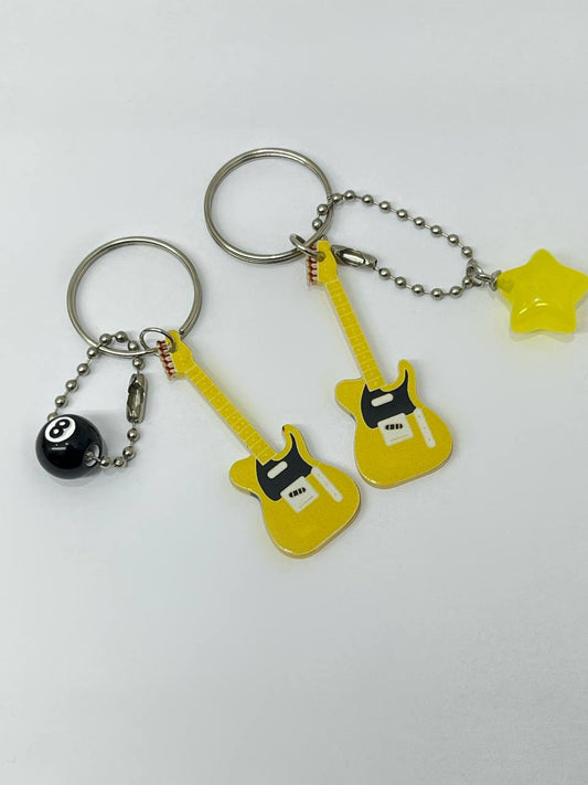 Yellow electric guitar keychains.